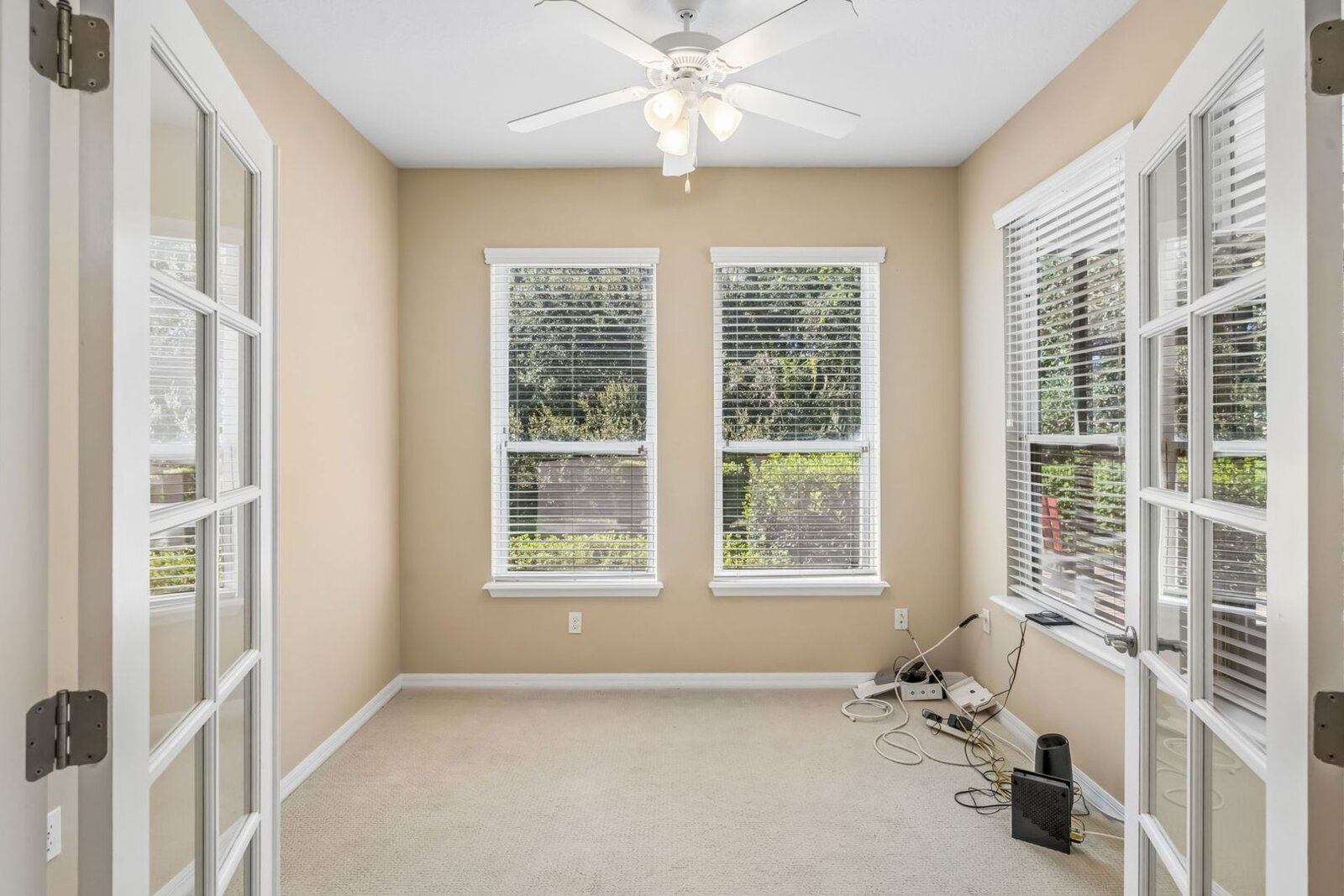 Full-size den with three windows at 374 Salt Marsh Ln