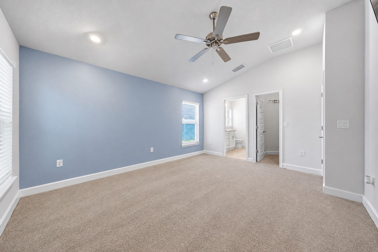 Primary bedroom with ceiling fan at 1261 Tupelo Cir