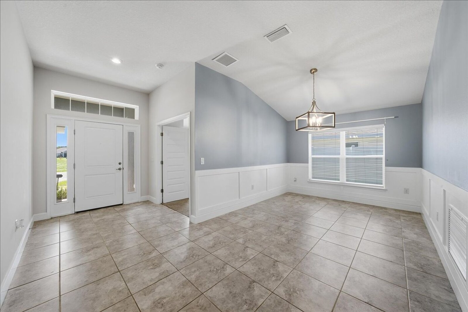 Tiled foyer and formal dining room at 1261 Tupelo Cir