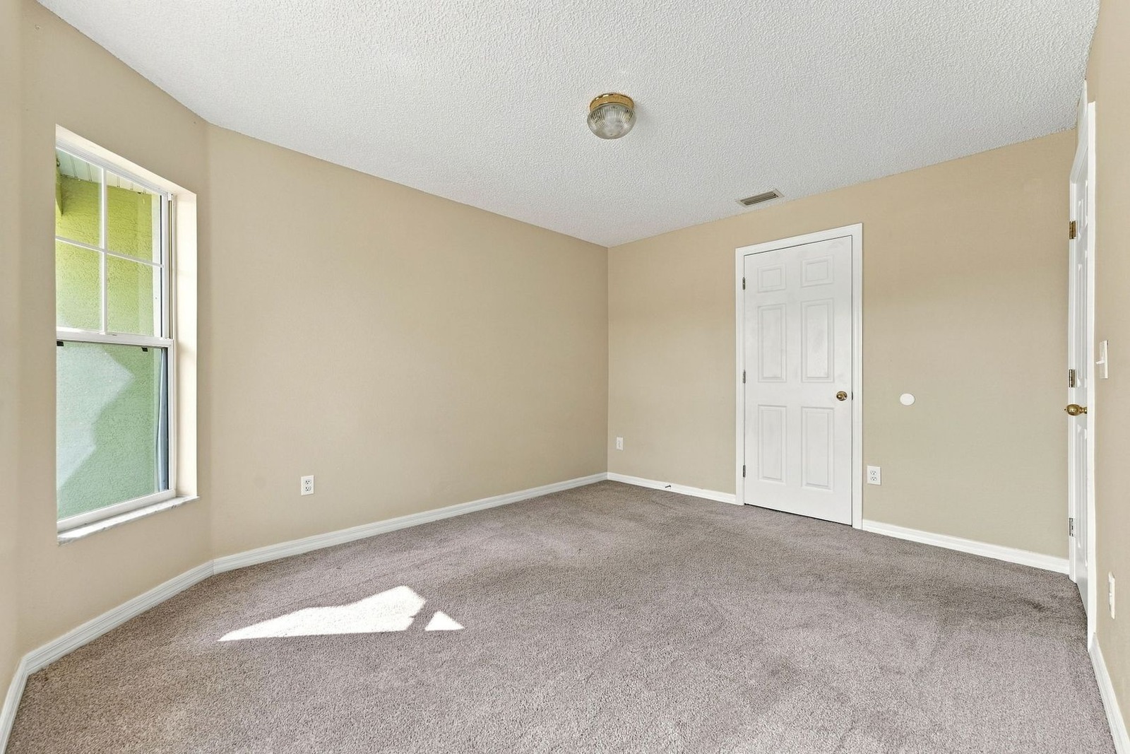 Third bedroom with closet and windows at 707 Merrimac St SE