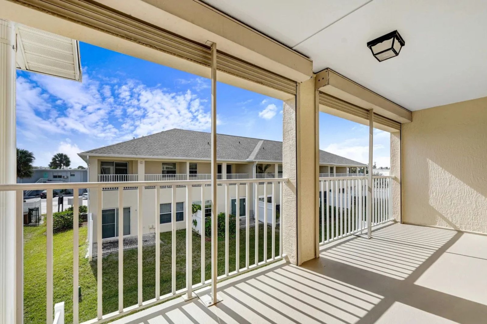 Private covered balcony off the primary suite at 5201 Ocean Beach Blvd #20