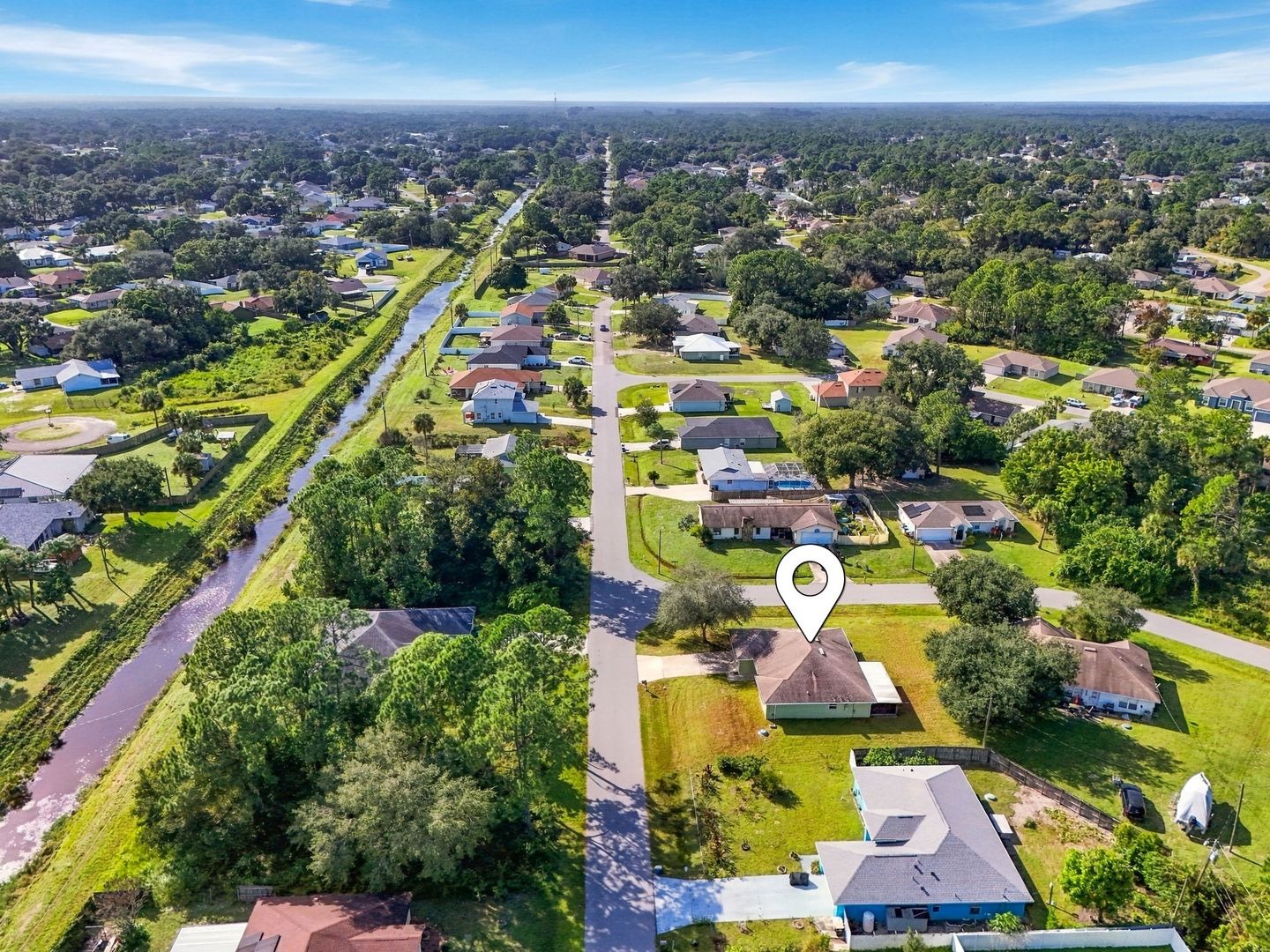 Aerial view toward the canal with location marker on 707 Merrimac St SE