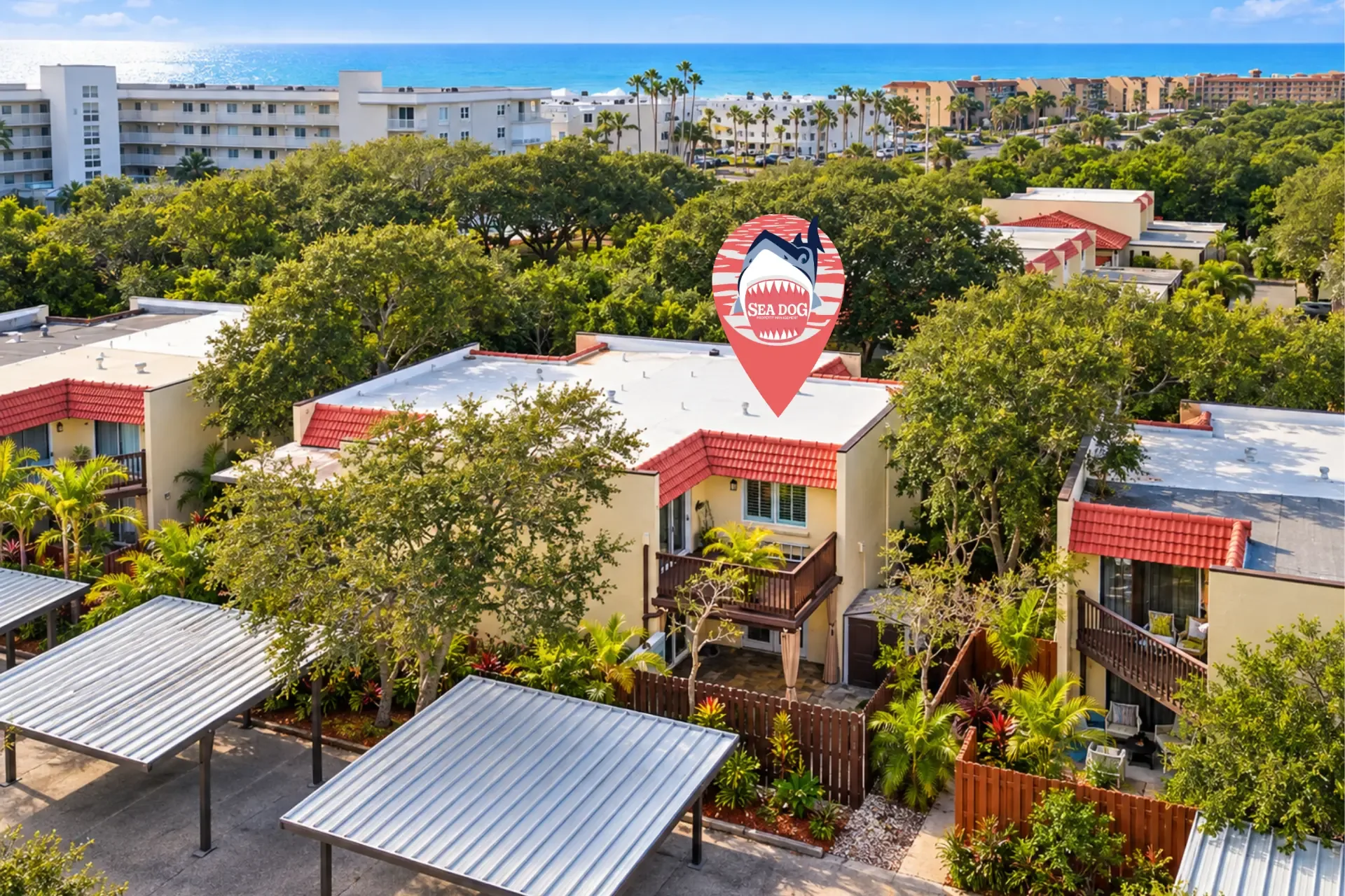Aerial view of 8760 Live Oak Ct in Ocean Woods, Cape Canaveral, with the community pool and beach beyond