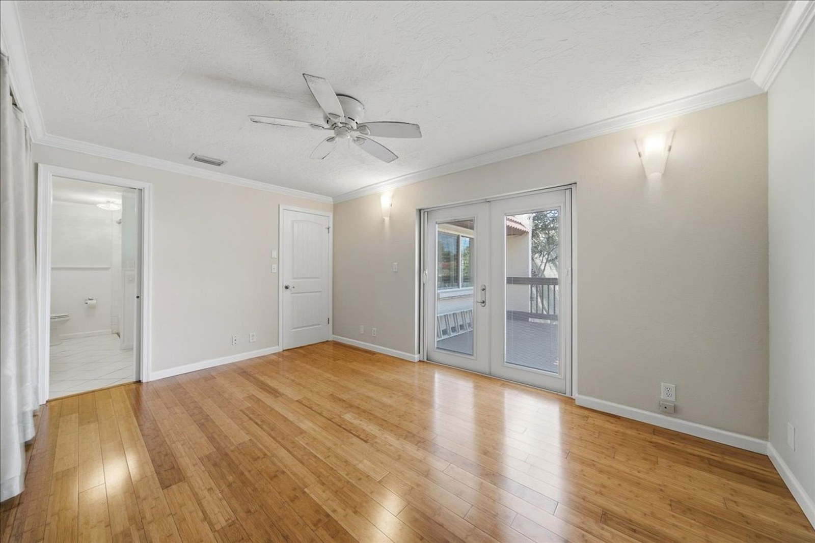 Living room with French doors to the patio and no carpeting