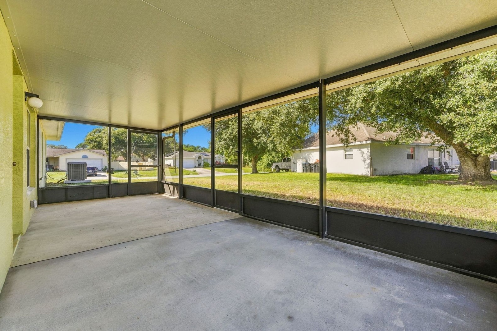 Screened porch looking out to the backyard at 707 Merrimac St SE