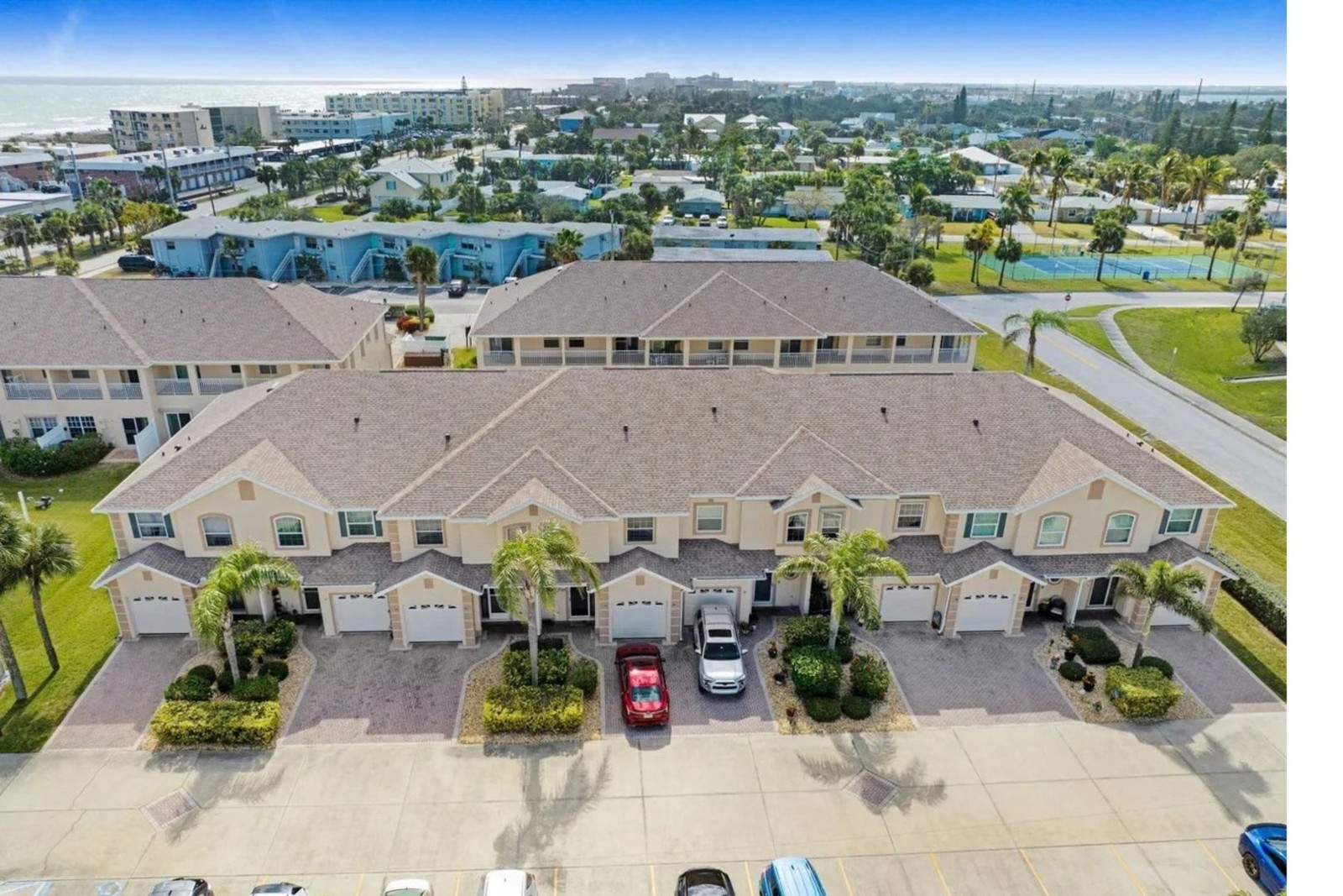 Aerial view of the building front and garages at 5201 Ocean Beach Blvd