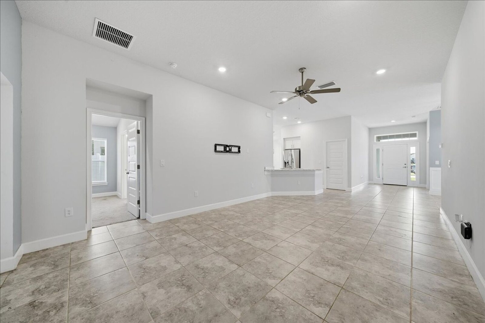 Large family room with ceiling fan at 1261 Tupelo Cir