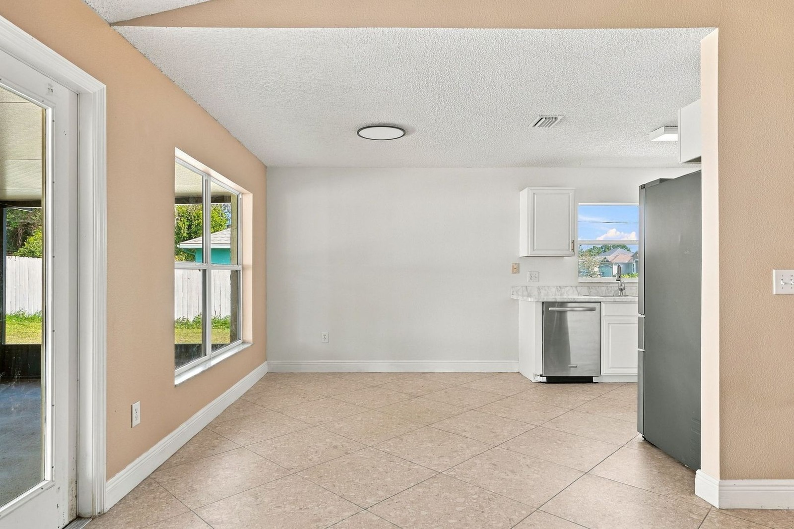 Eat-in kitchen area with window and view to the great room at 707 Merrimac St SE