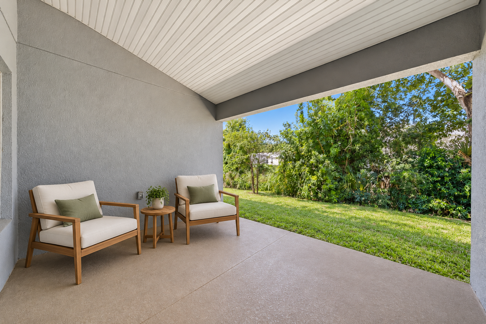 Covered lanai and backyard at 1261 Tupelo Cir (virtually staged)