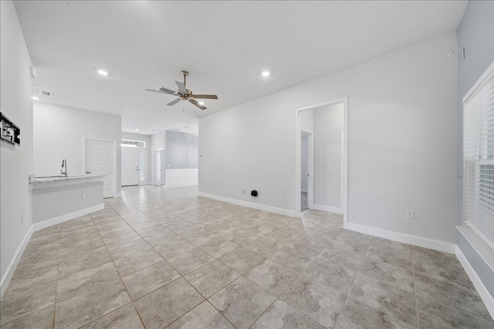 Family room looking toward the kitchen and hallway at 1261 Tupelo Cir