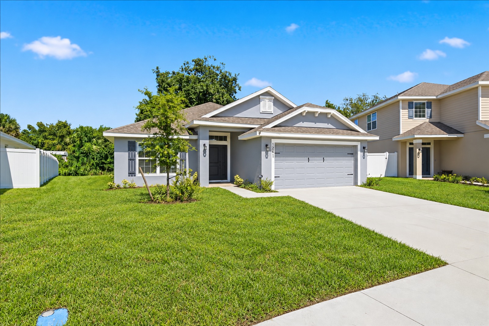 Front exterior and lawn of 1261 Tupelo Cir from the street