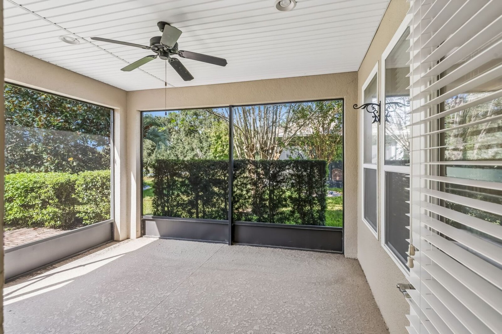 Screened patio with ceiling fan at 374 Salt Marsh Ln