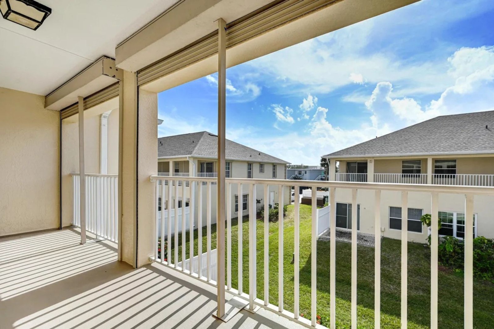 Side view from the covered balcony at 5201 Ocean Beach Blvd #20
