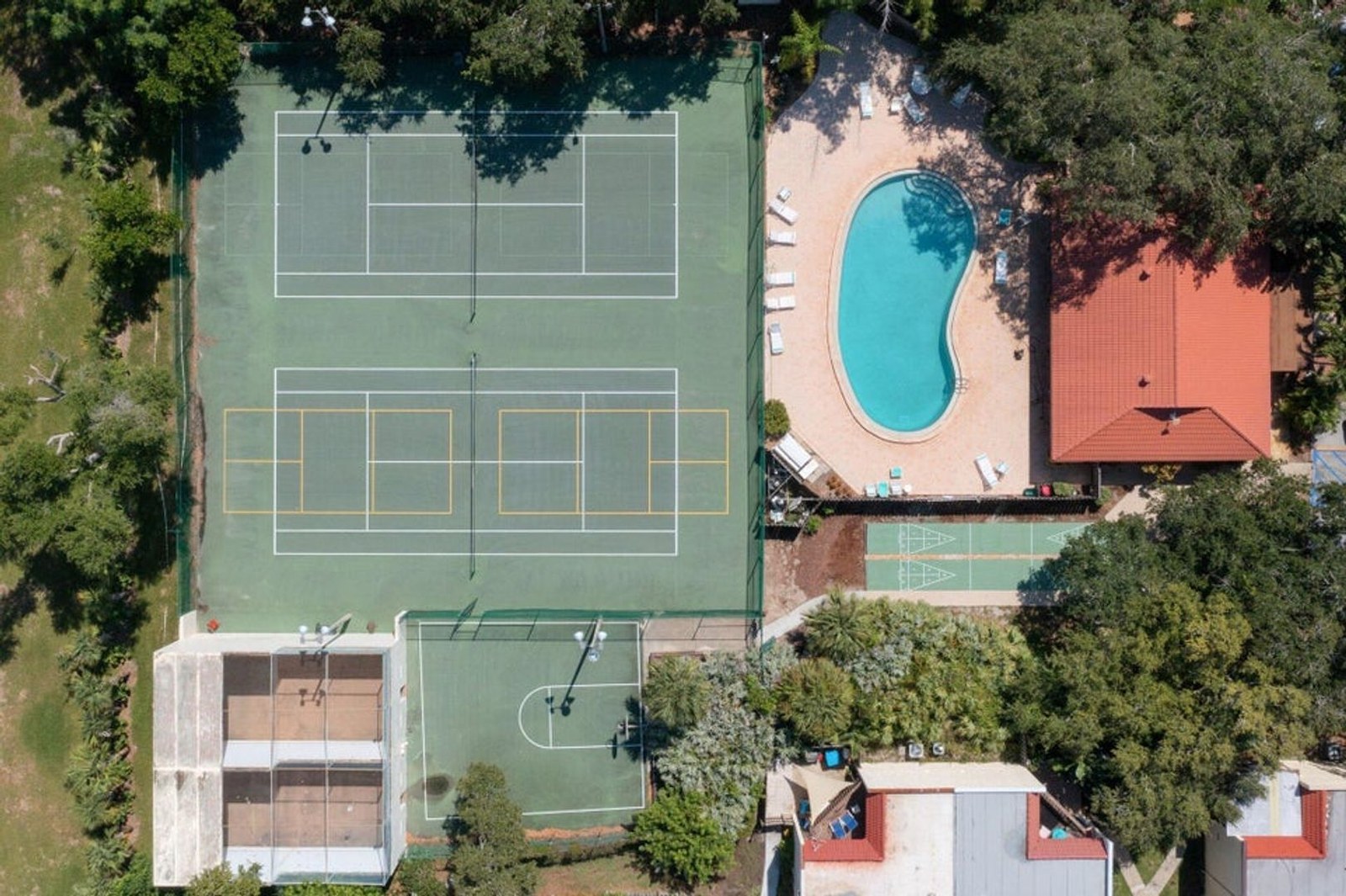 Aerial view of Ocean Woods tennis courts and pool in Cape Canaveral