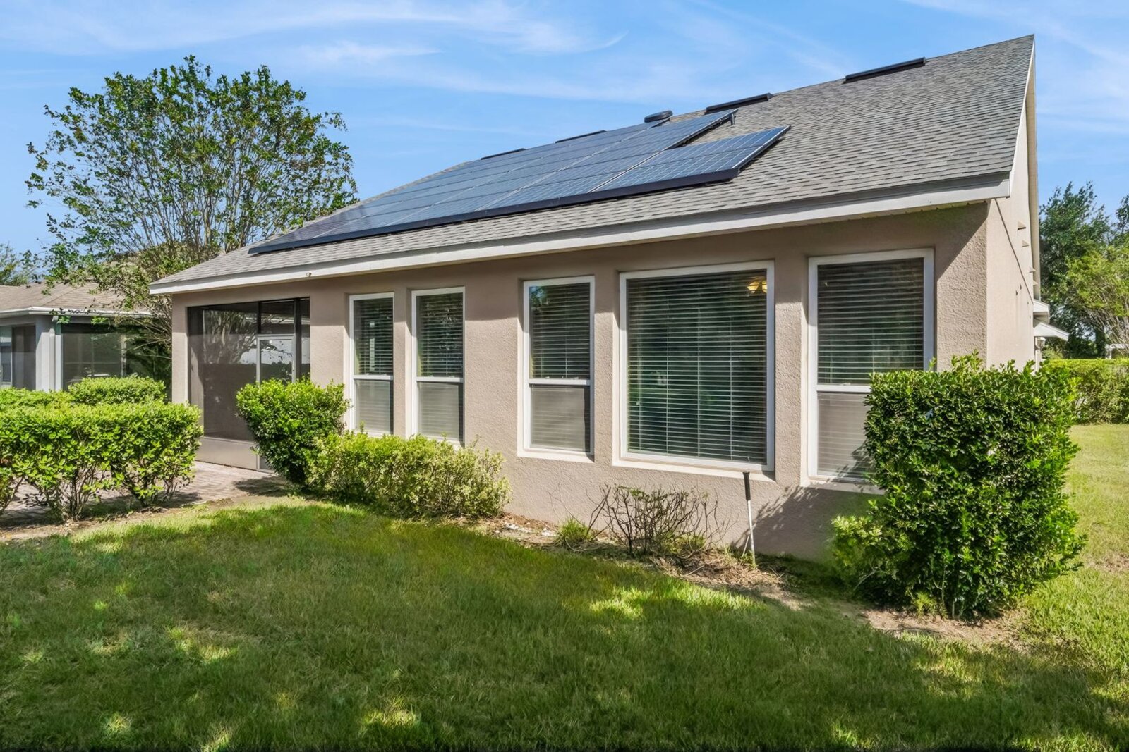 Rear exterior with solar panels at 374 Salt Marsh Ln