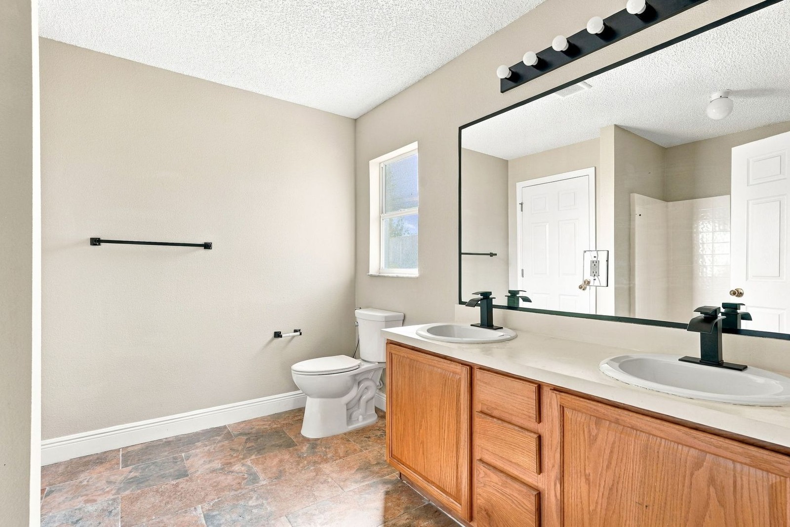 Primary bath with double vanity at 707 Merrimac St SE