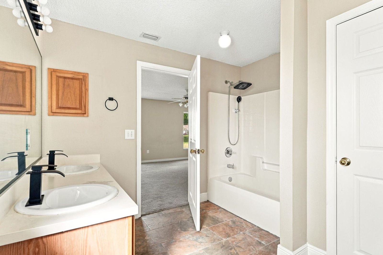Primary bath with tub and shower at 707 Merrimac St SE