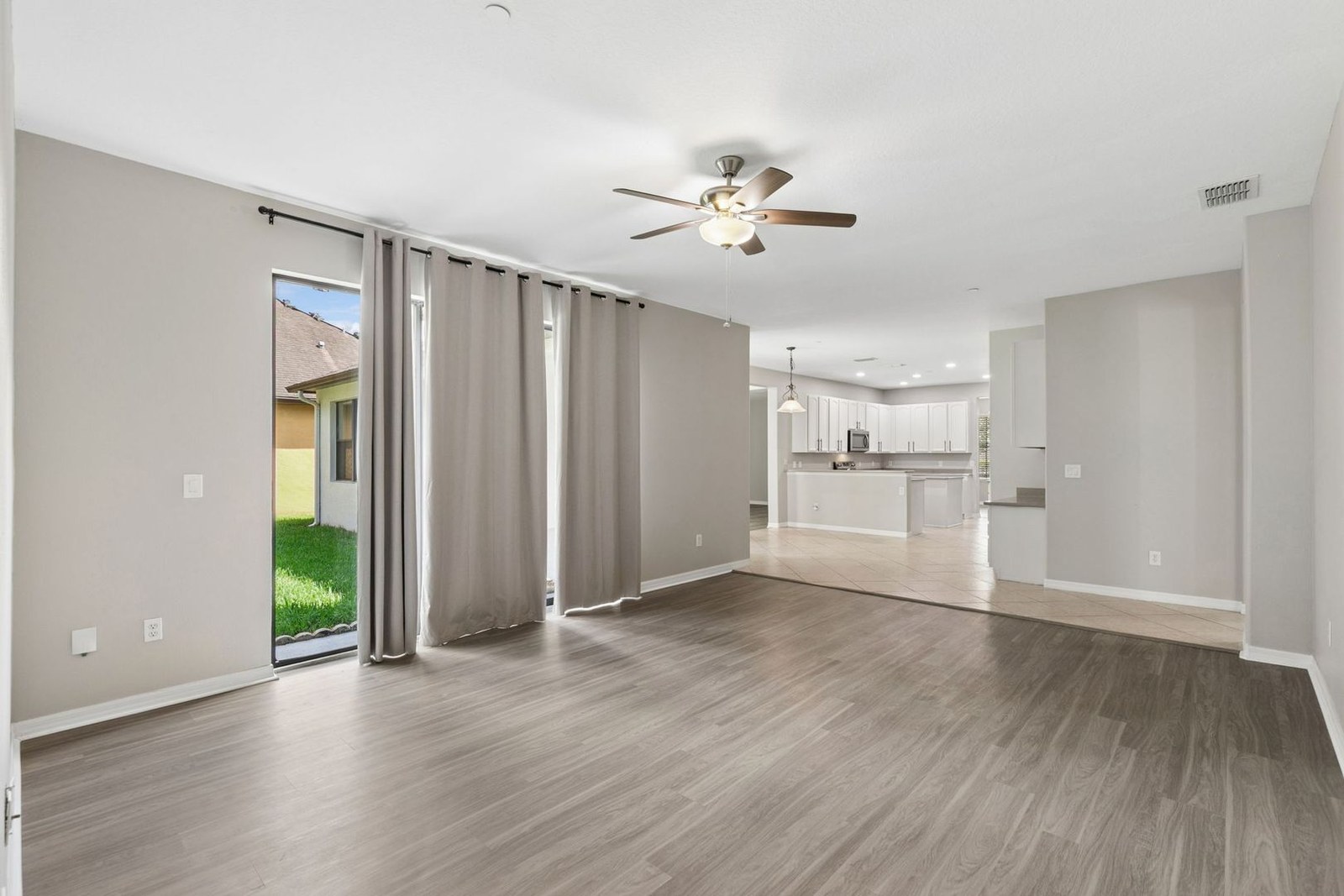 Family room open to the kitchen with conservation views