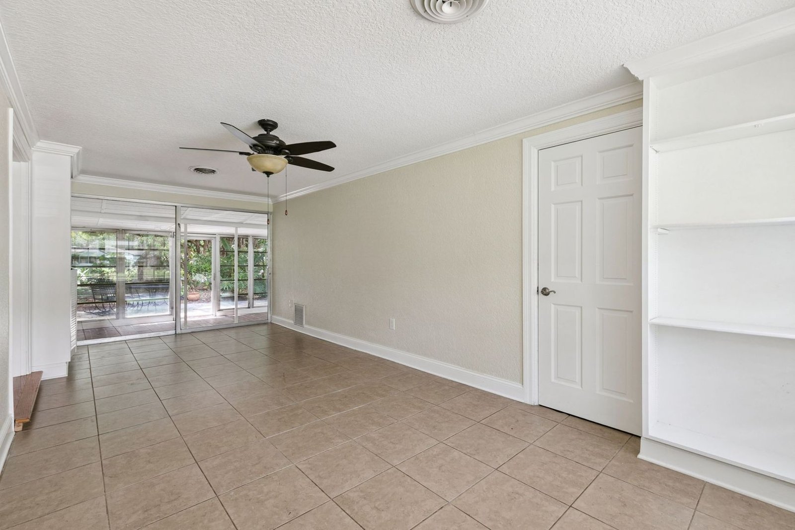 Open family room with hardwood floors and ceiling fan at 3306 Eagle Blvd