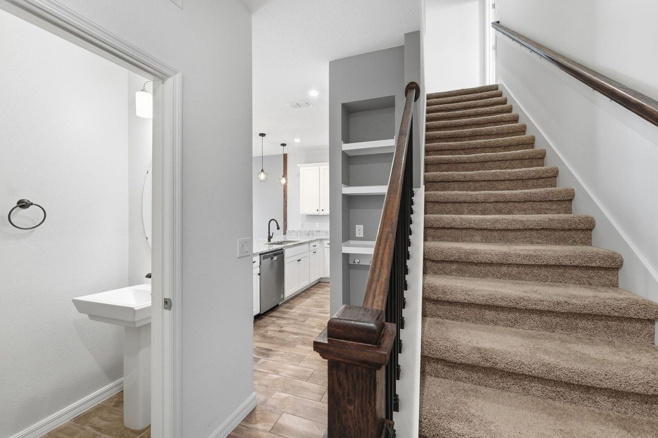 Built-in shelving and drop zone by the stairs