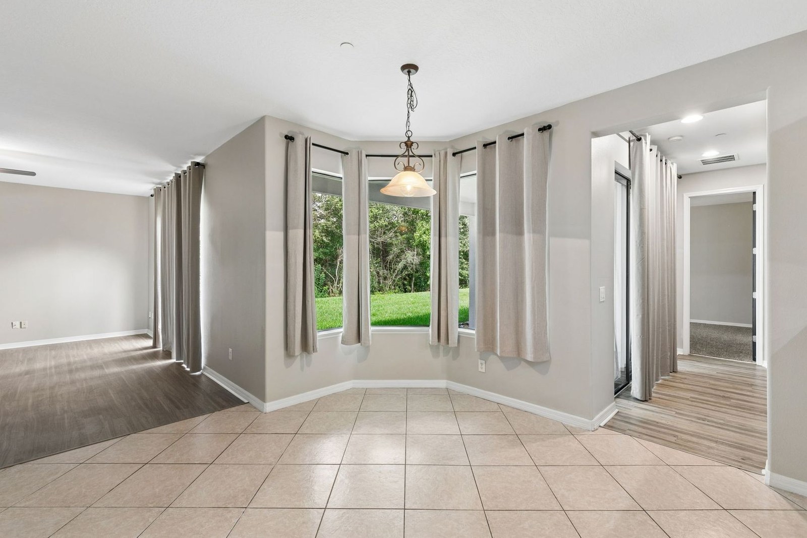 Breakfast nook with bay windows and conservation views at 10249 Park Row Ct