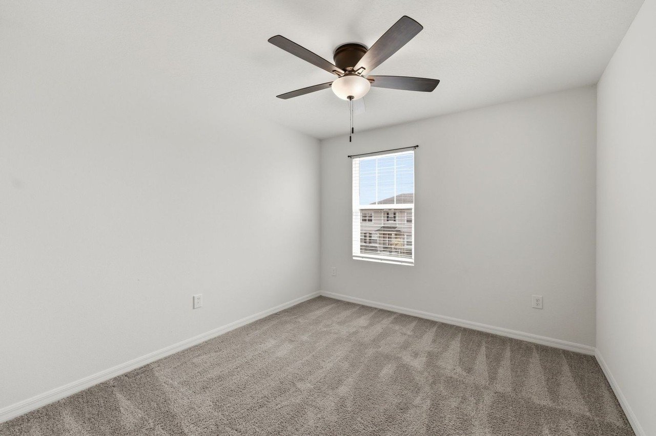 Third bedroom with ceiling fan