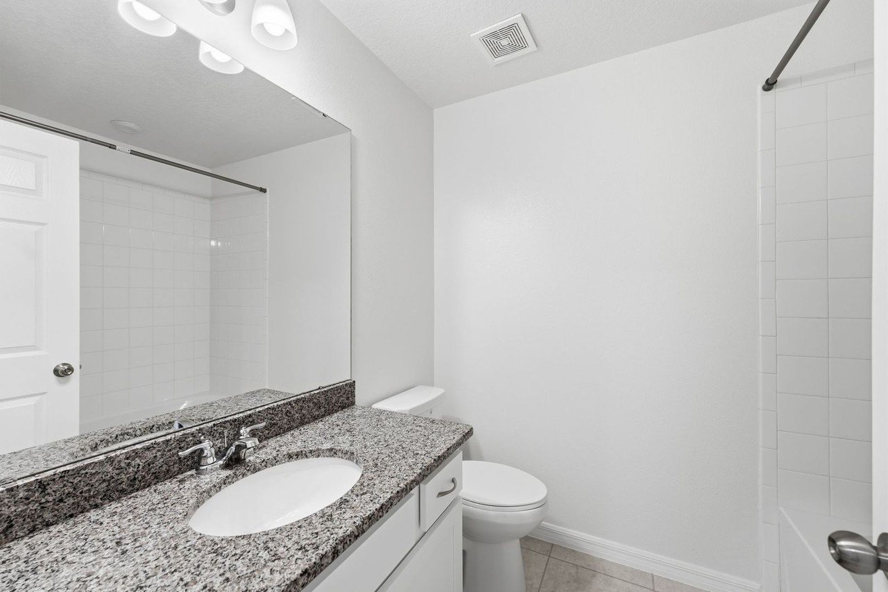 Downstairs powder bath with granite vanity
