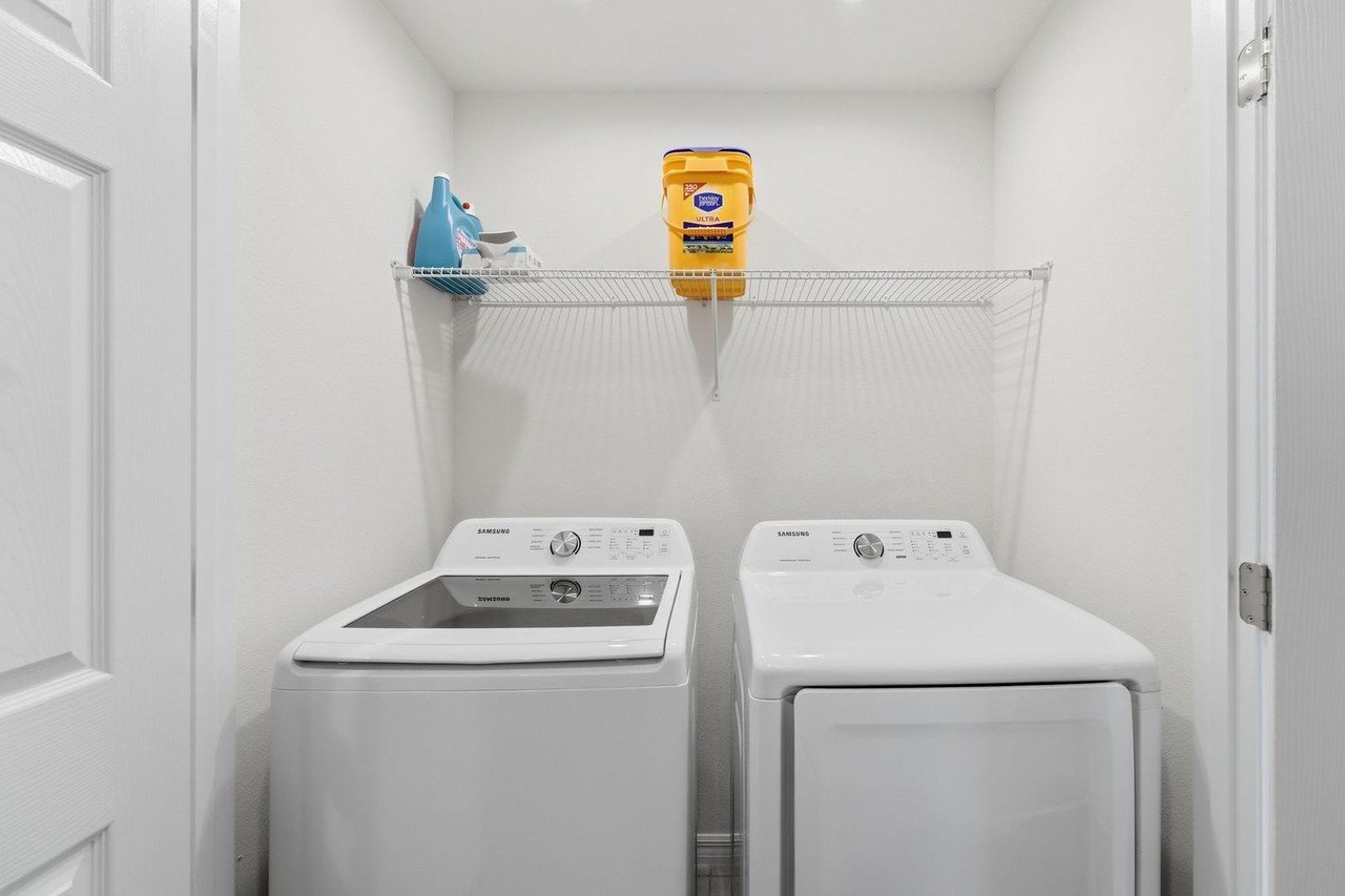 Laundry room with washer and dryer included