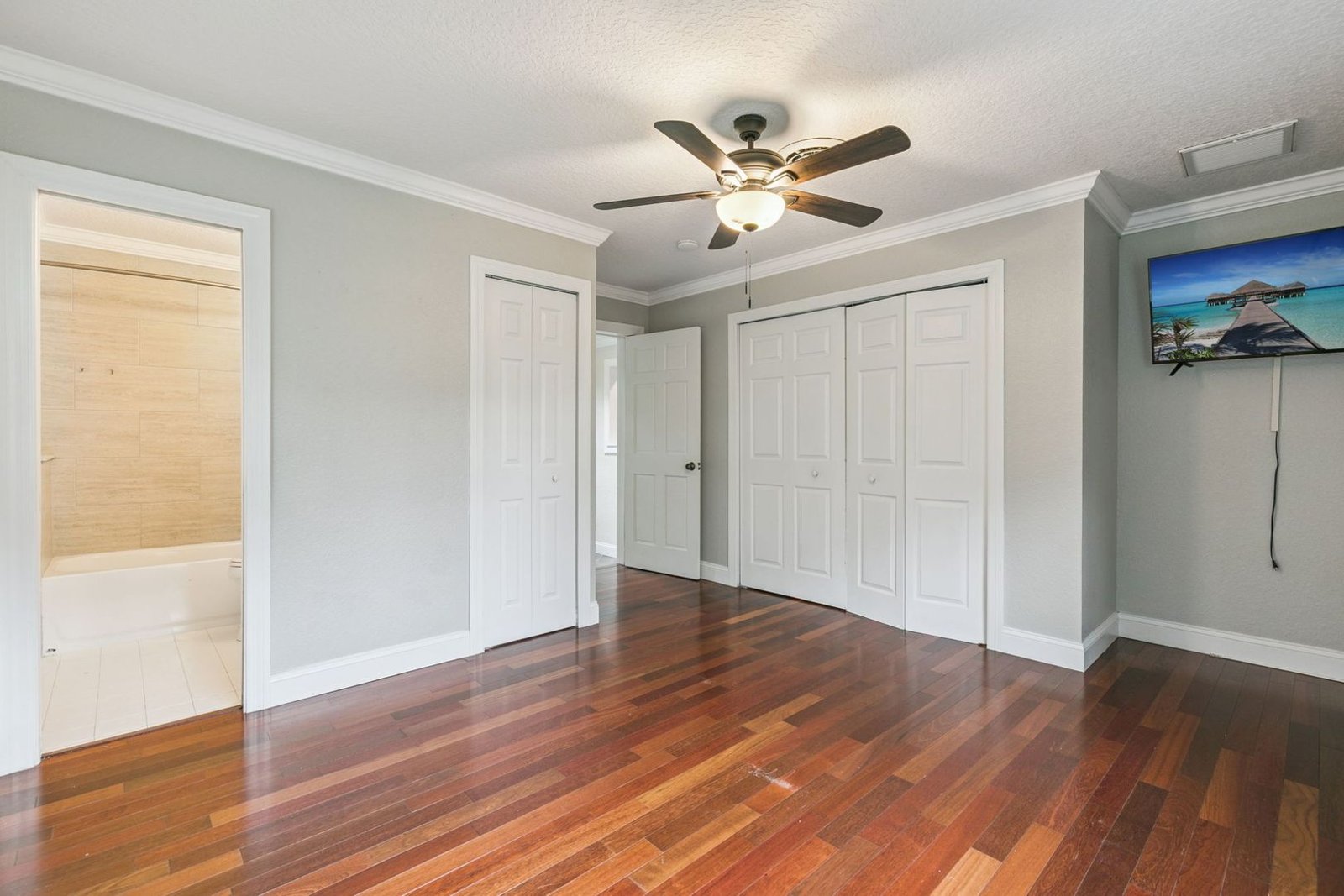 Bedroom with wood floors and closet at 3306 Eagle Blvd