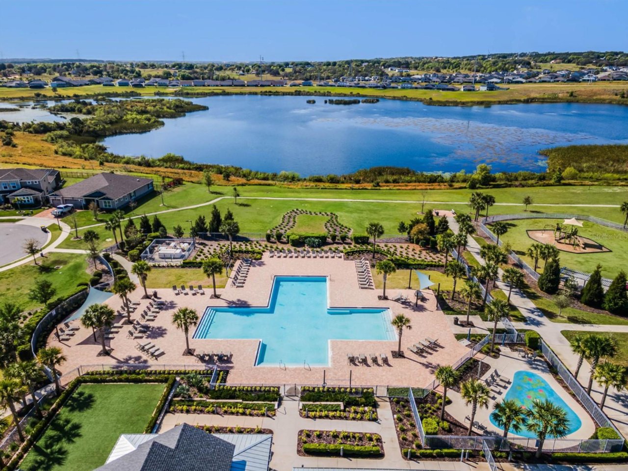 Aerial view of the Waterbrooke amenity center, pool, and lake