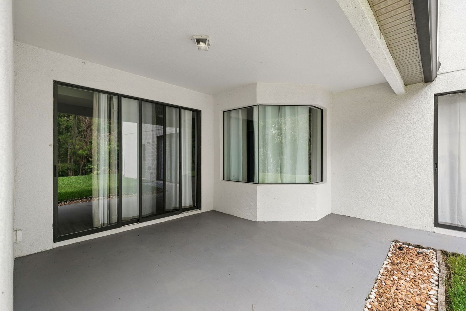 Covered lanai with sliders and conservation views at 10249 Park Row Ct