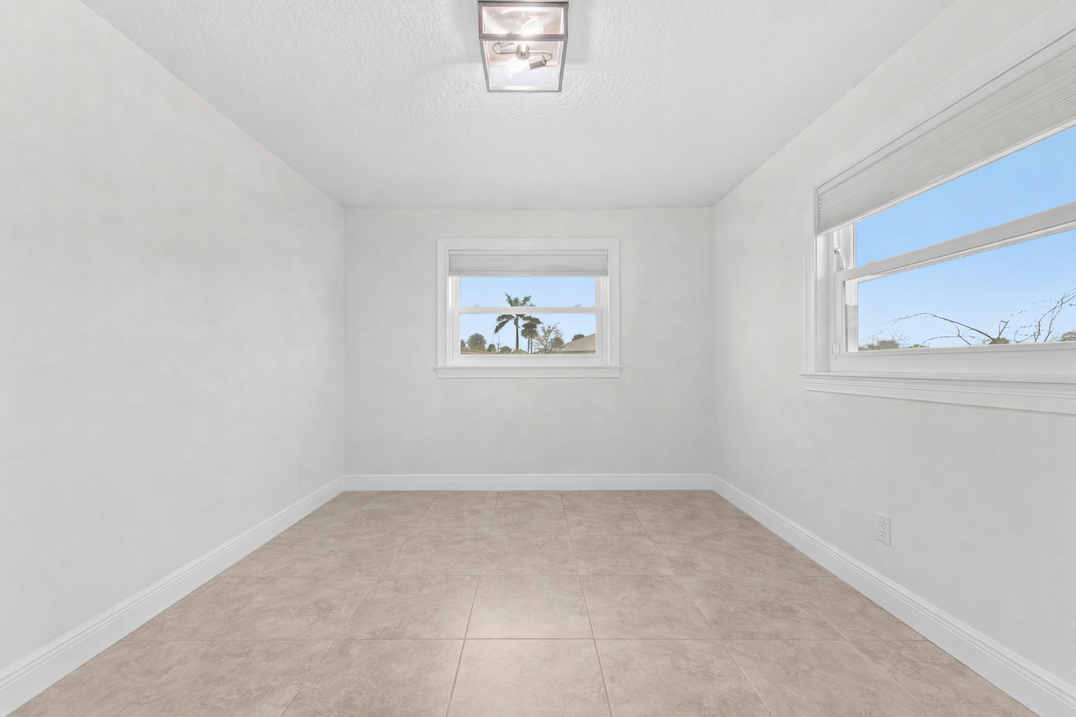 Secondary bedroom with dual windows