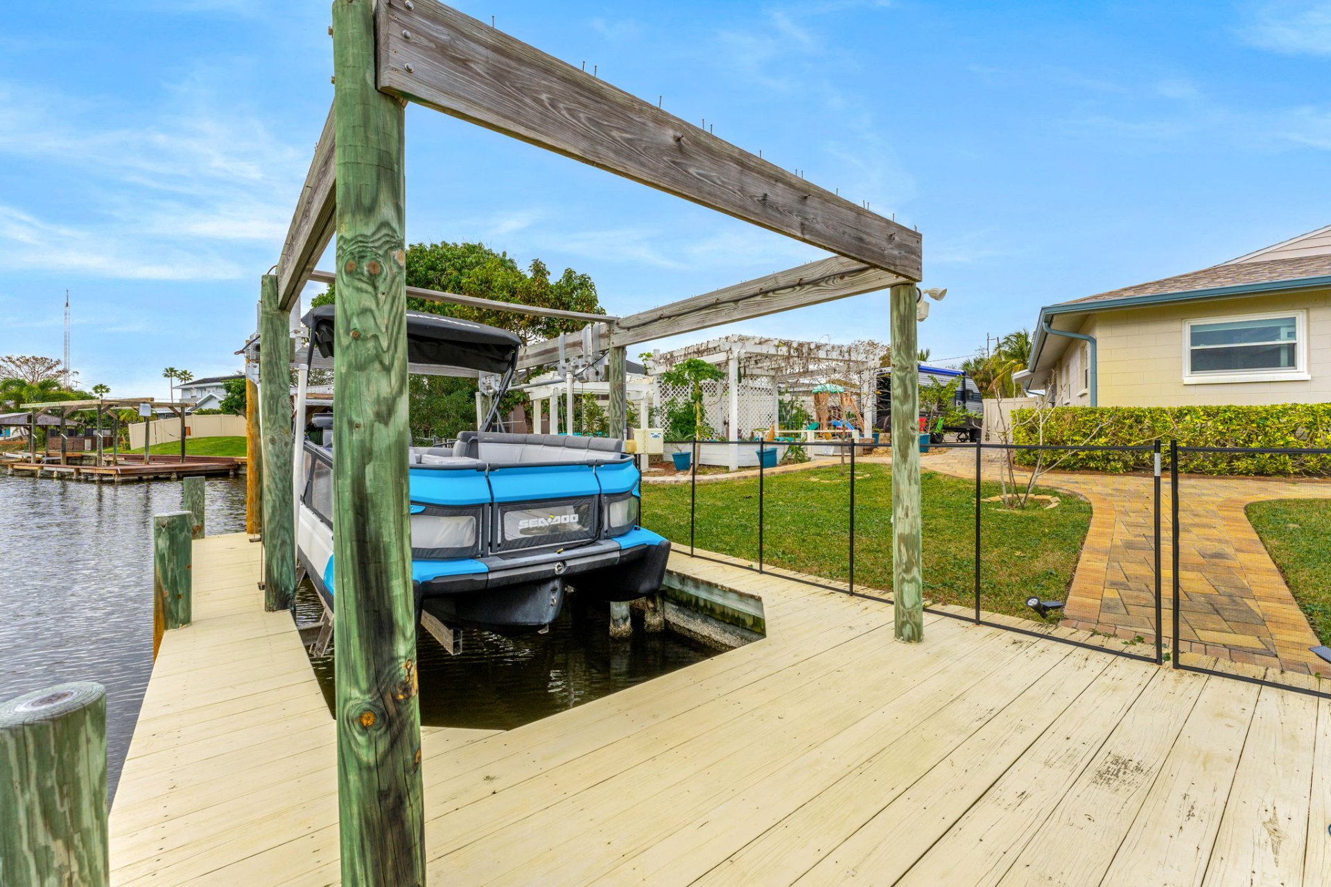 Private boat lift and dock on the canal