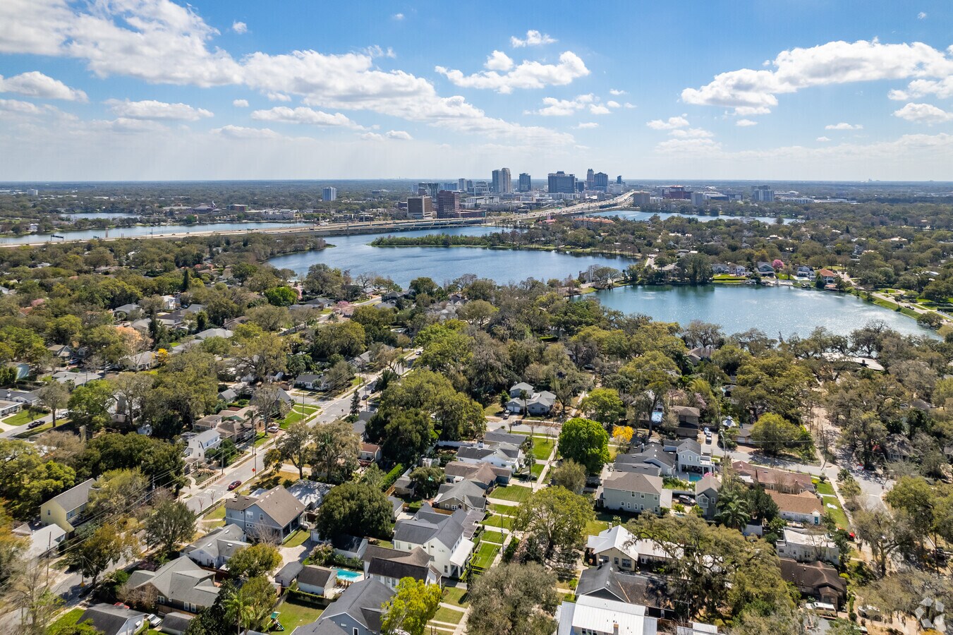 Tree-lined Edgewater Drive in College Park, Orlando with mid-century homes and Lake Adair