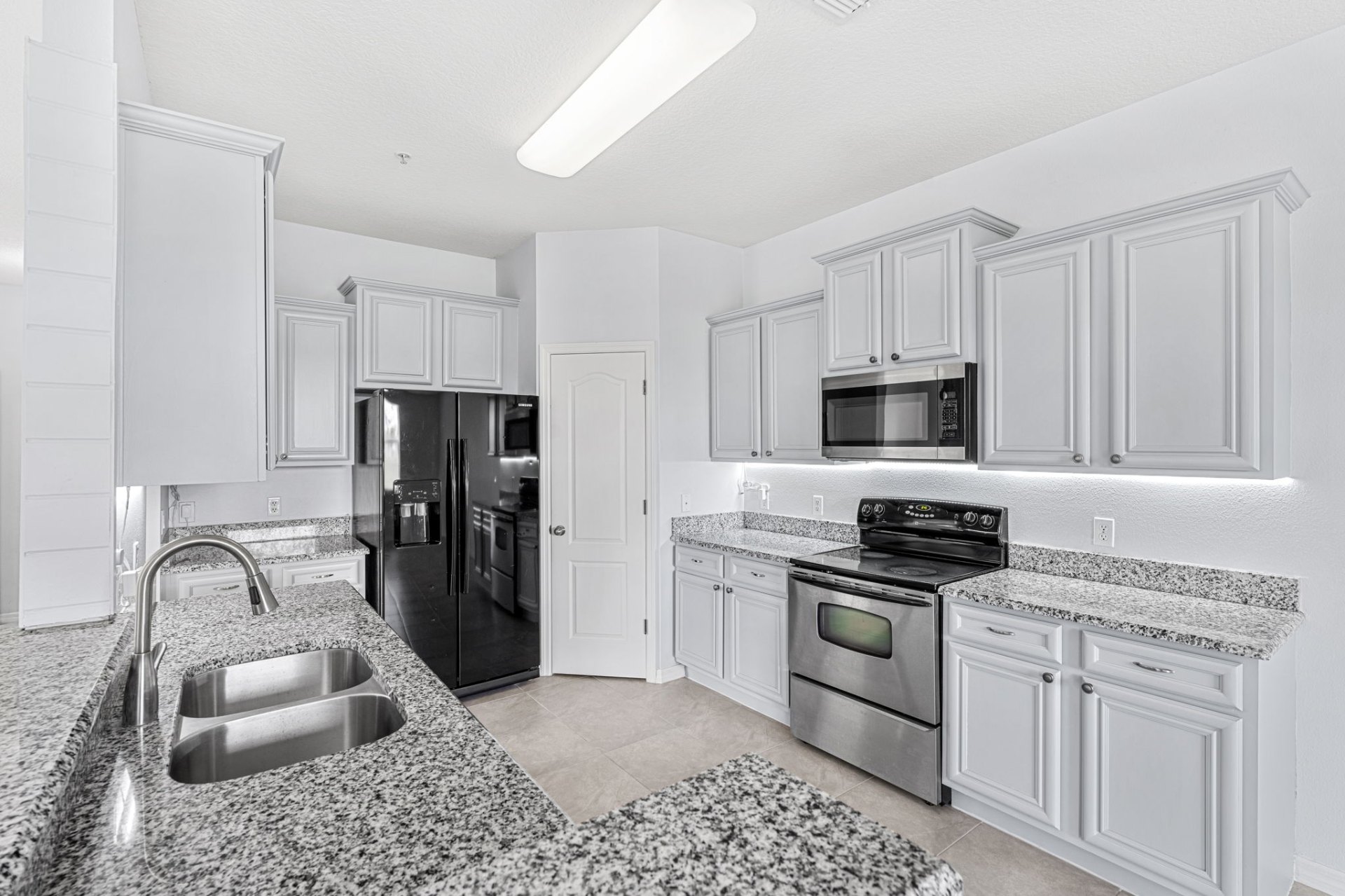 Kitchen with granite counters and stainless range