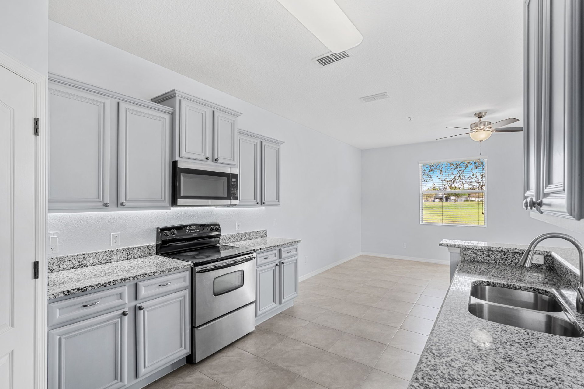 Kitchen with granite counters and dining area