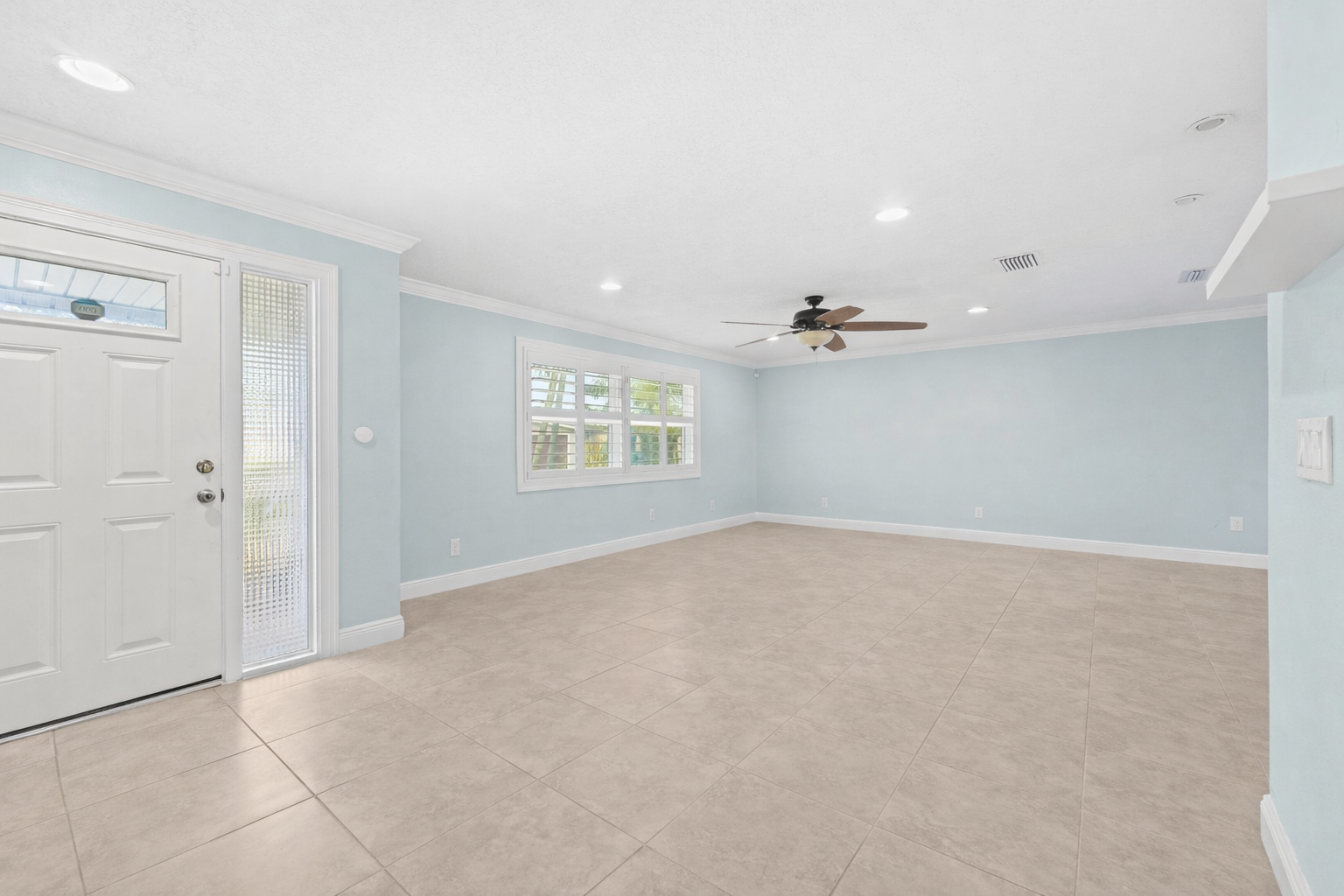 Spacious living room with front entry