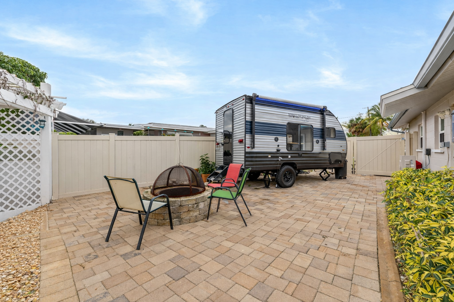 RV parking area with paver pad and fenced side yard