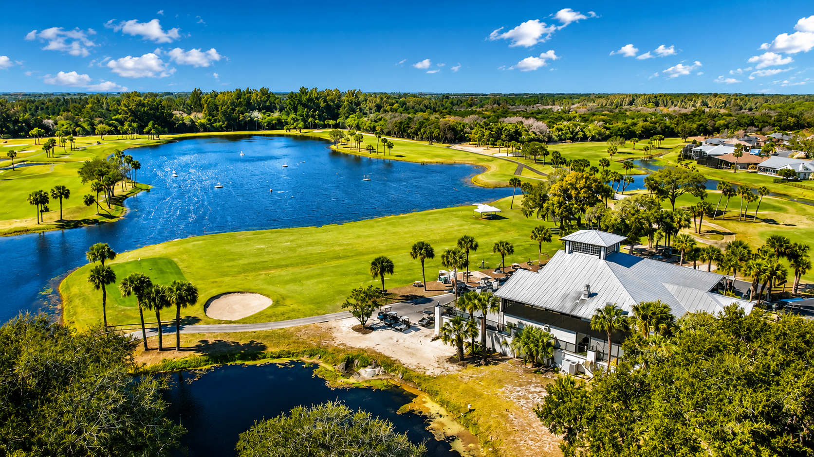 Aerial view of The Savannahs gated golf community on Merritt Island with golf course, lakes, and clubhouse