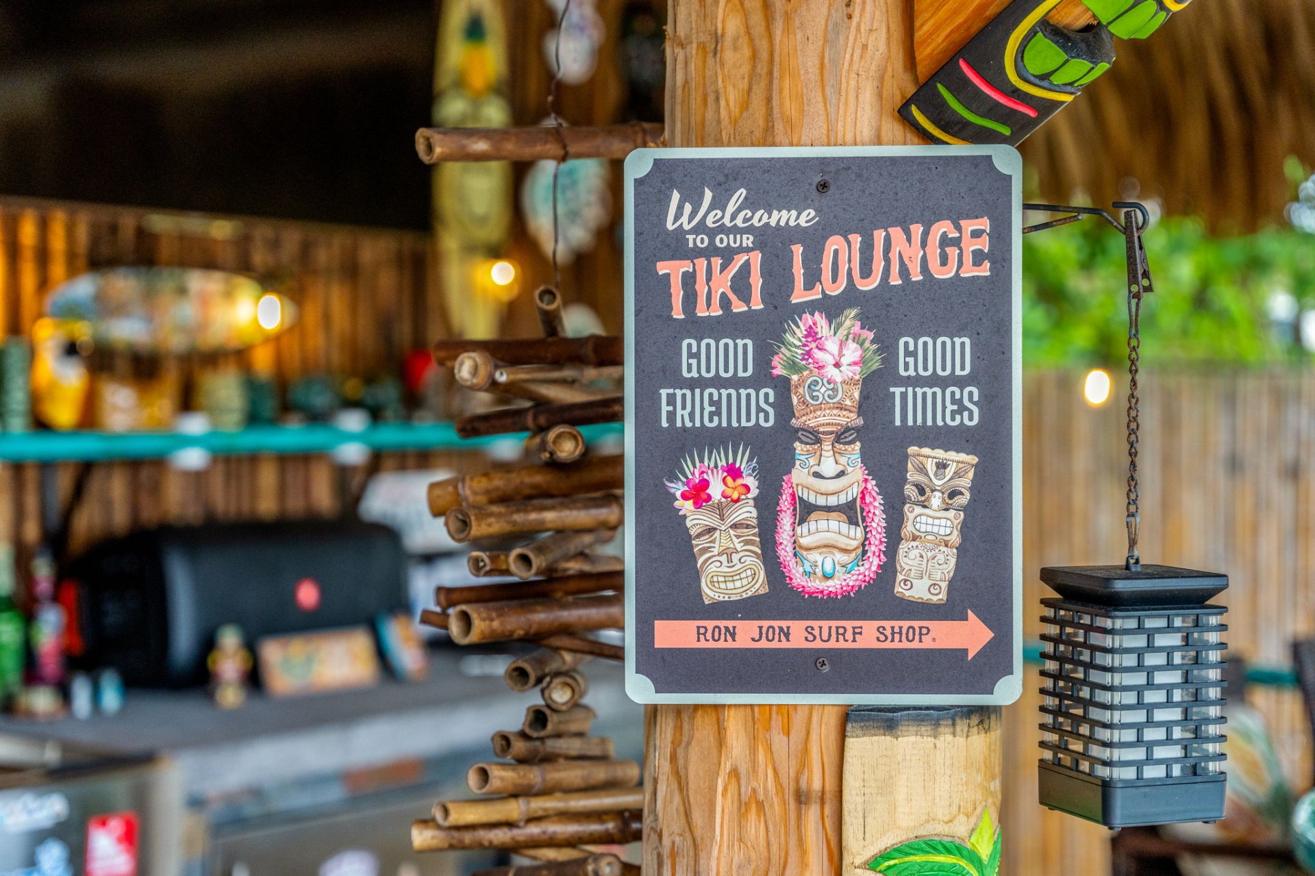 Tiki lounge sign inside the outdoor bar area