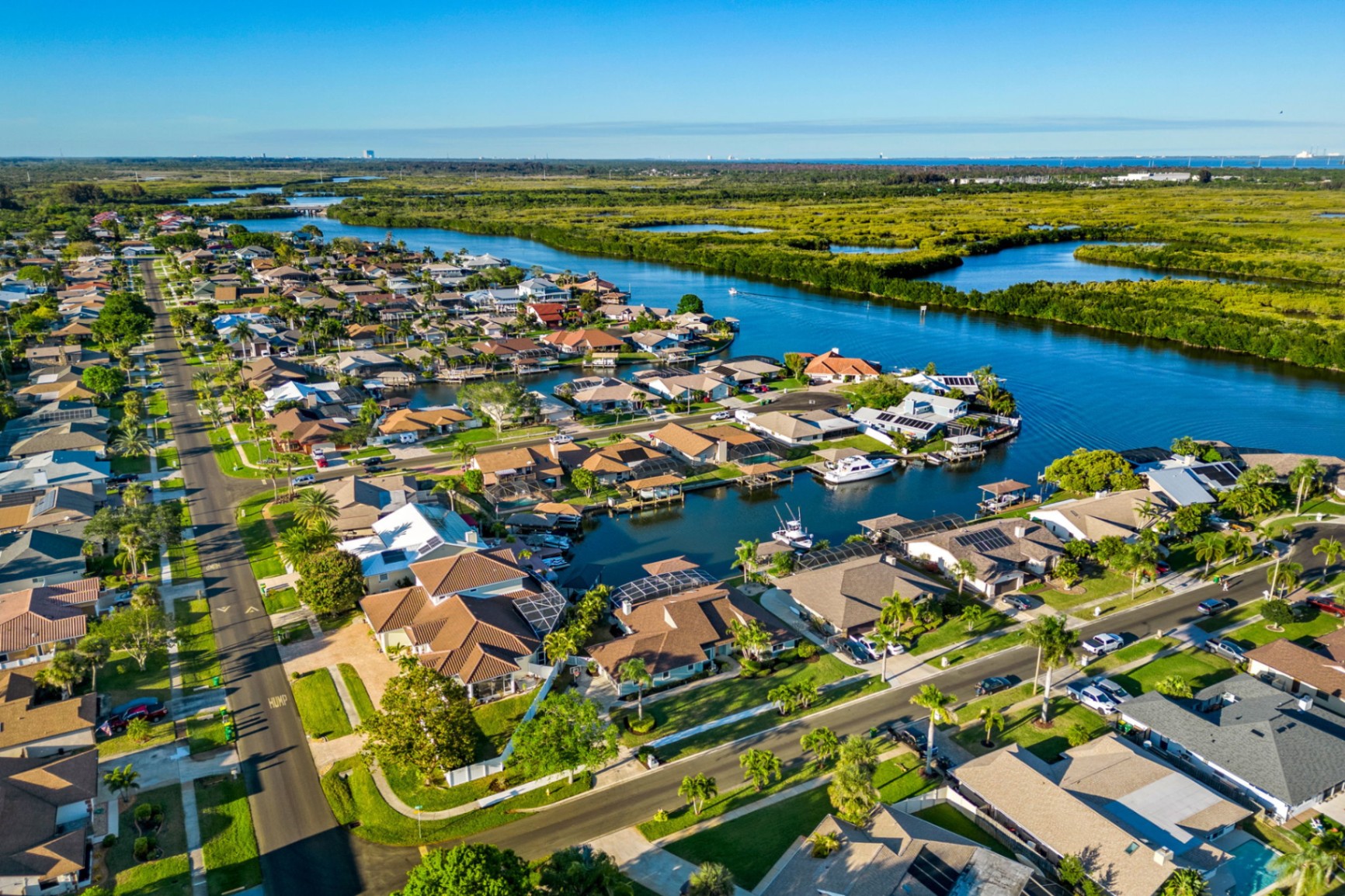 Aerial view of Villa de Palmas canal-front homes on Sykes Creek, Merritt Island