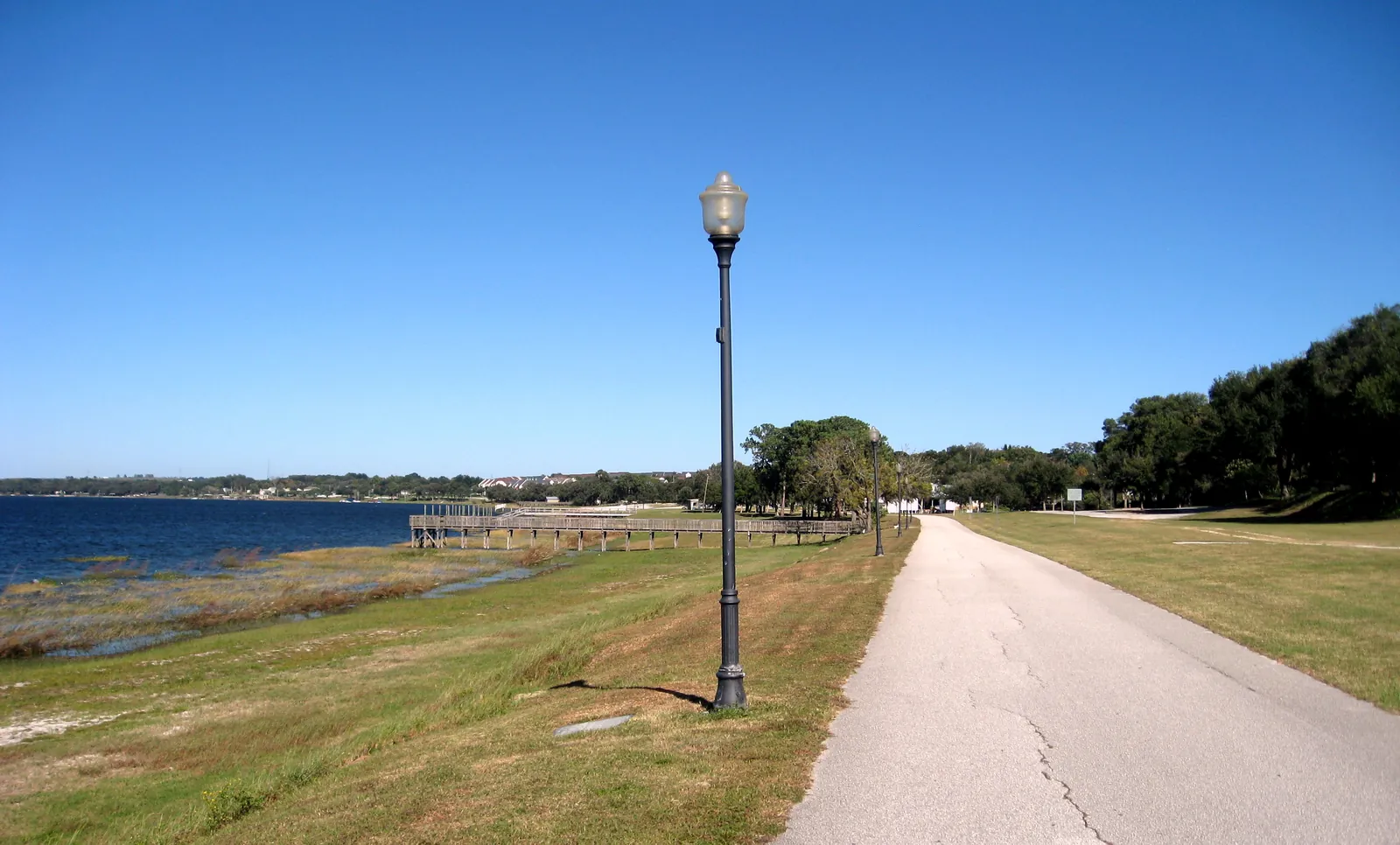 The paved South Lake Trail along Lake Minneola, the trail now extending west into Groveland FL